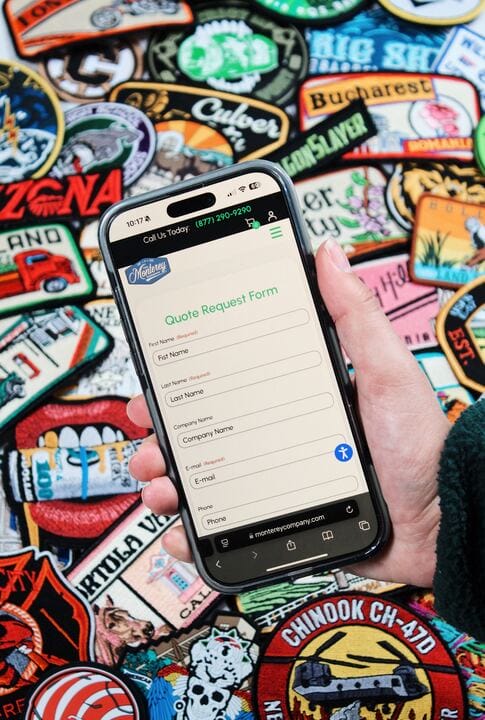 Phone in hand with patches in the back