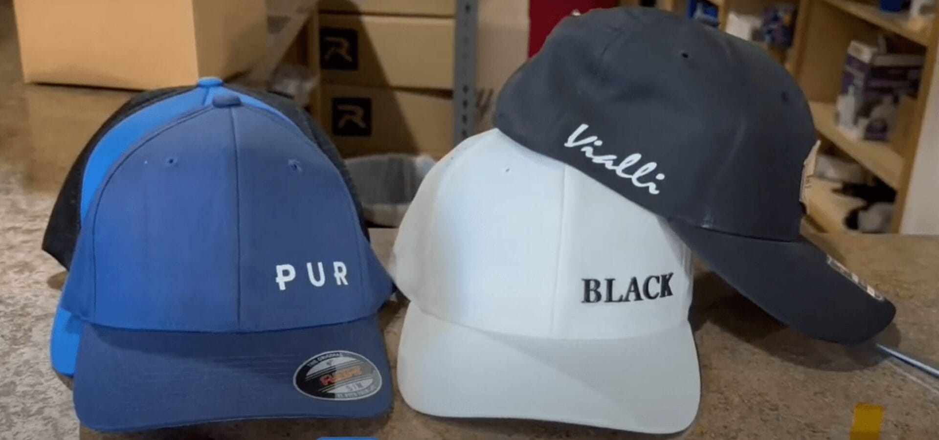 three hats with silicone transfer patches