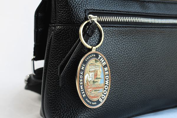 custom enamel keychain on purse